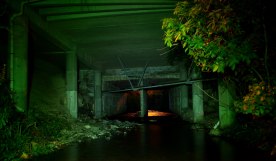 The stream passes right underneath many commercial properties.